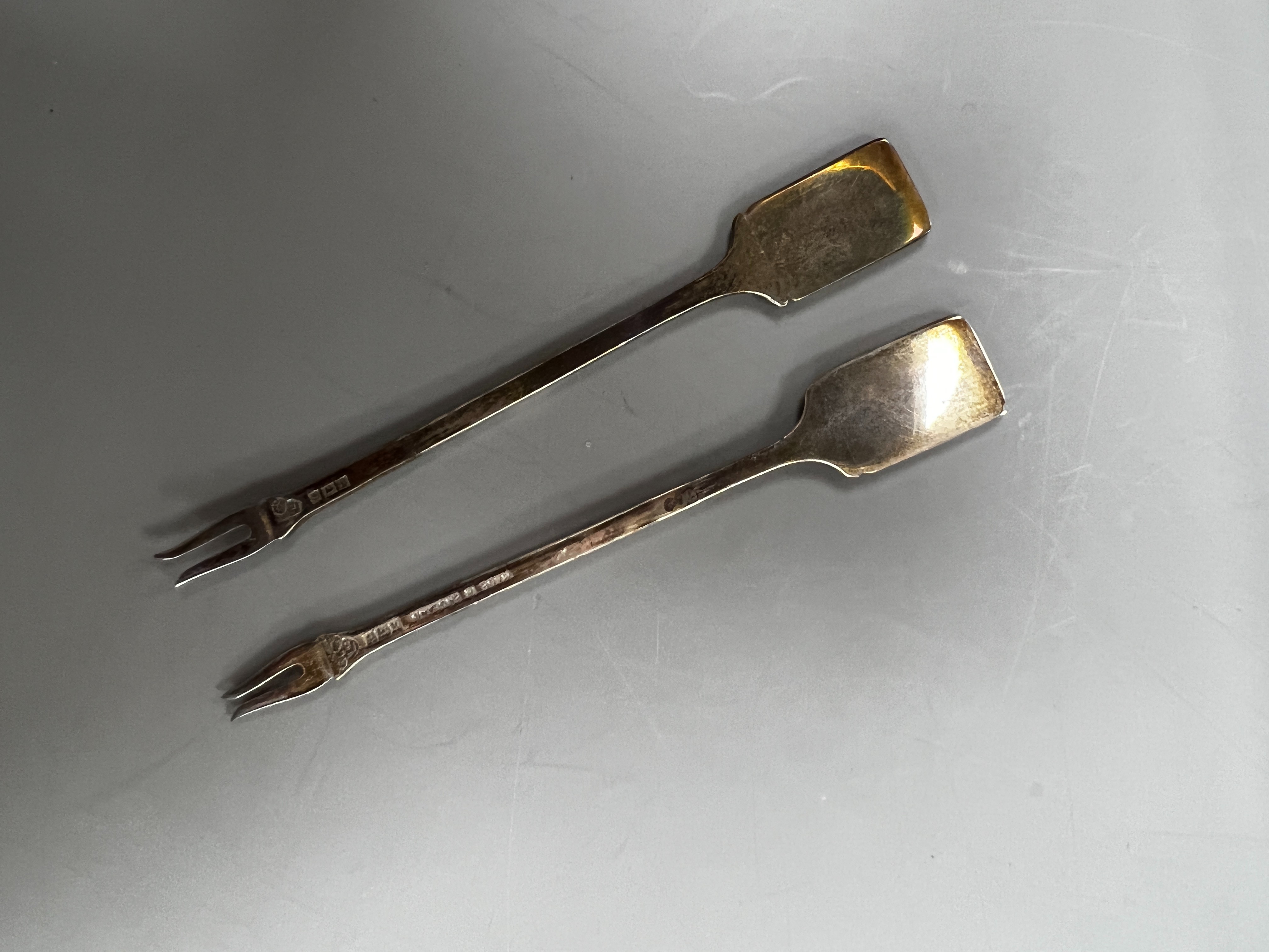 A cased set of twelve early 1960's silver and enamel cocktail sticks, by Garrard & Co, with playing card terminals, Birmingham, 1961.